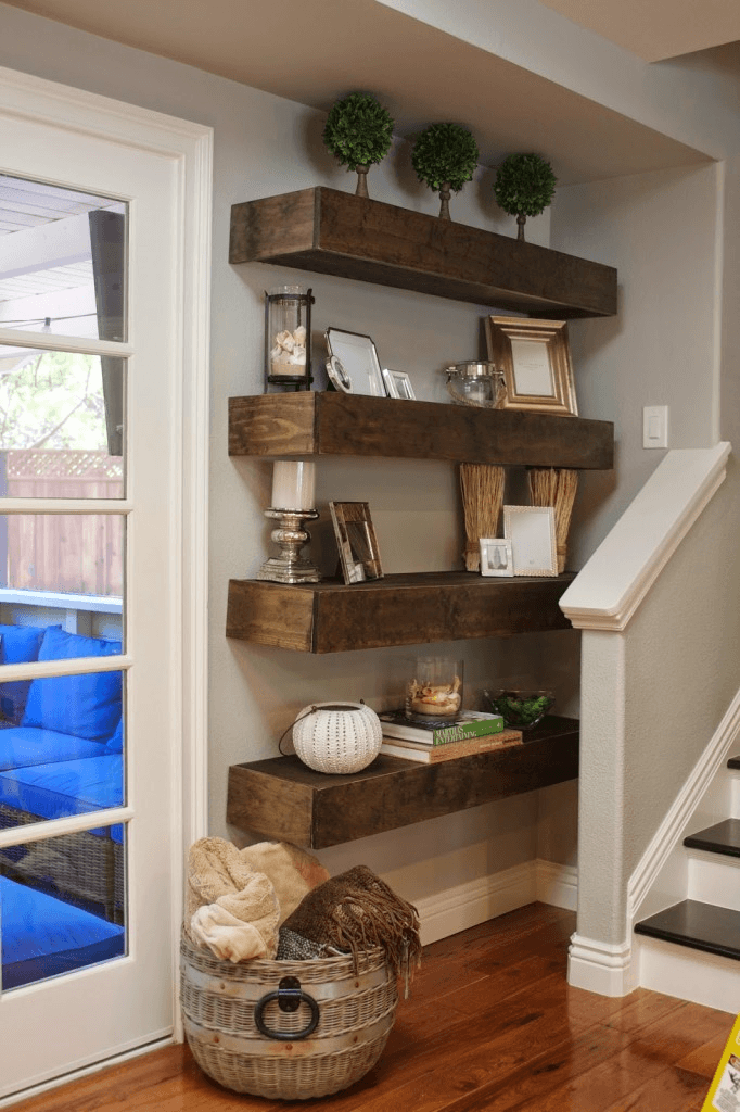 Custom architectural detail, electric fireplace surround, and floating shelves